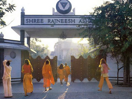 Osho - Bhagwan Shree Rajneesh ashram gate with an equilateral triangle turned upside down - symbol of Satanism