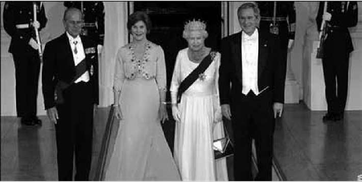 George Bush with queen Elisabeth showing the satanic hand sign of "Horned Hand or The Mano Cornuto" with his left hand