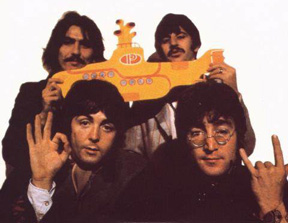 John Lennon showing the devil's horn hand sign